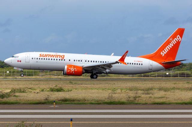 Boeing 737-700 (C-FMXA) - For the 1st time Sunwing touches down in Aruba.