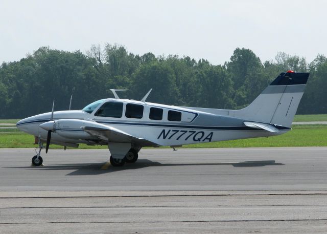 Beechcraft Baron (58) (N777QA) - Parked at Downtown Shreveport.