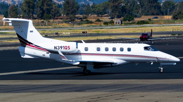 Embraer Phenom 300 (N391QS) - EXECJET 391 taxiing into the Five Rivers Aviation area. Came from SFO and later headed down to SNA. 