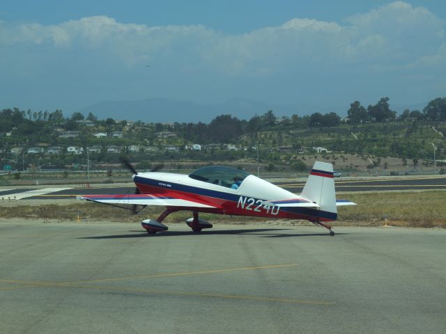 Beechcraft Baron (58) (N224D) - Extra 300L in run-up area at Camarillo, CA