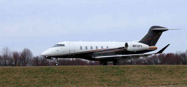 Canadair Challenger 350 (N572FX) - Taxiing for departure is this 2014 Bombardier Challenger 350 from the Winter of 2023.