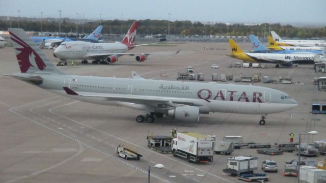 Airbus A330-200 (A7-ACJ) - parked in gate, view from Terminal 1 Car Park (Manchester Airport)