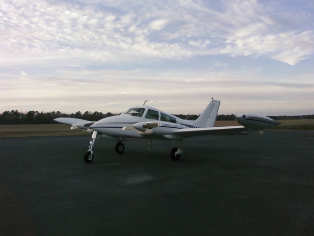 Cessna 310 (N4169Q) - Sitting on the ground at Dublin, GA (KDBN) at twilight.