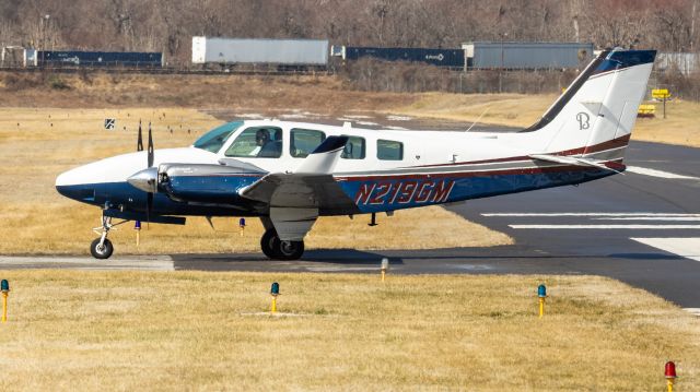 Beechcraft Baron (58) (N219GM) - N219GM turning off of College Park Airport's runway 15 