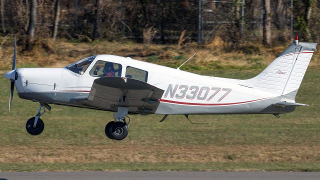 Piper Cherokee (N33077) - N33077 climbing out of College Park Airport's runway 33 for a flight to Easton 