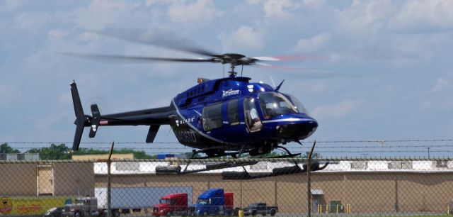 Bell 407 (N406TD) - LINDEN AIRPORT-LINDEN, NEW JERSEY, USA-JULY 15, 2021: A helicopter operated for the Blade Company is seen taking off shortly after refueling at Linden Airport.