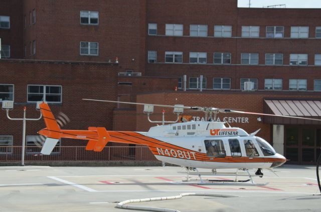 Bell 407 (N408UT) - University of Tennessee's LifeStar departing the University of TN Medical Center pad.