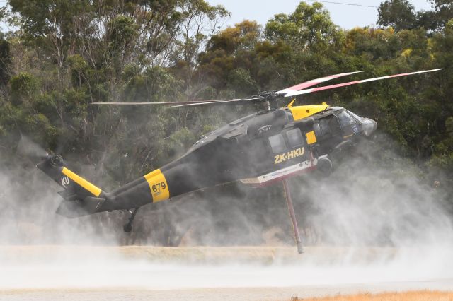 ZK-HKU — - HLTK679 refilling in a small dam 