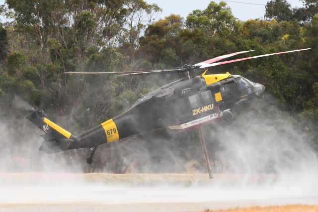 ZK-HKU — - HLTK679 refilling in a small dam 