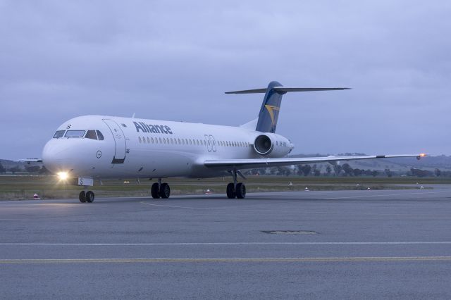 Fokker 100 (VH-XWS) - Alliance (VH-XWS), now wearing the Alliance livery, Fokker 100 taxiing at Wagga Wagga Airport.