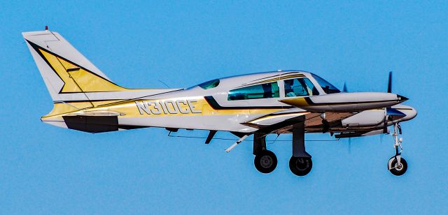 Cessna 310 (N310CE) - N310CE 1974 Cessna T310Q s/n 310Q1063 - North Las Vegas Airport KVGTbr /Photo: TDelCorobr /February 14, 2011 