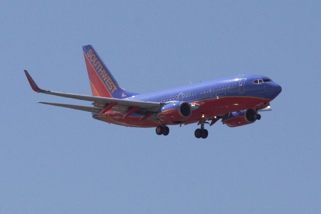 Boeing 737-700 (N236WN) - Rare sight around these parts. Chartered SWA 737-700 pays a visit. I was able to catch it thanks to flightaware!