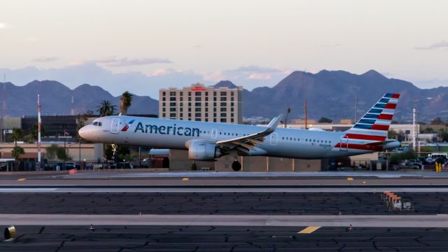 Airbus A321 (N403AN) - American Airlines A321 landing at PHX on 3/6/2022. Taken with a Canon 850D and Canon 75-300mm lens.