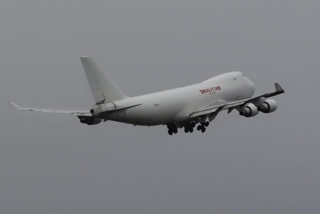 Boeing 747-400 (N716CK) - Takeoff to the north from 15-33 in the rain