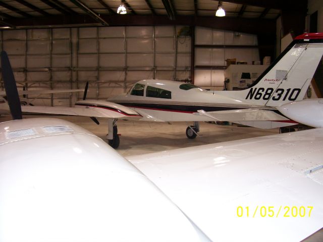 Cessna 310 (N68310) - At home in Watertown, South Dakota. Looking over the wing of 4025C, another 310R based at ATY