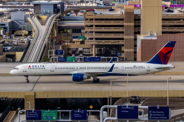 BOEING 757-300 (N586NW) - A Delta Airlines 757-300 taxiing at PHX on 2/13/23, the busiest day in PHX history, during the Super Bowl rush. Taken with a Canon R7 and Canon EF 100-400 II L lens.