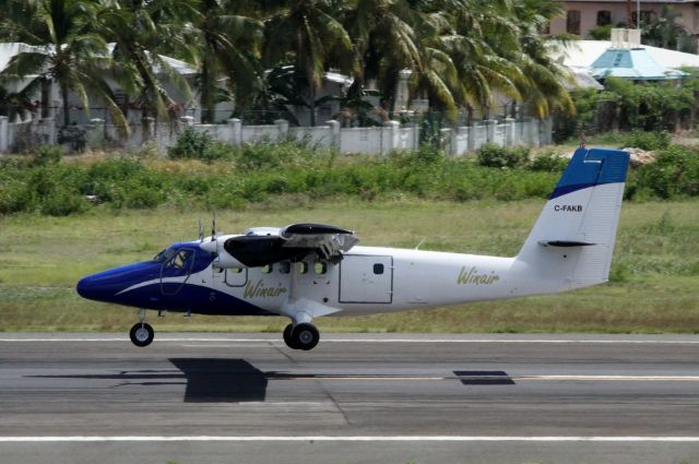 De Havilland Canada Twin Otter (C-FAKB) - First landing for this new bird at St Maarten in the humming bird paint job!