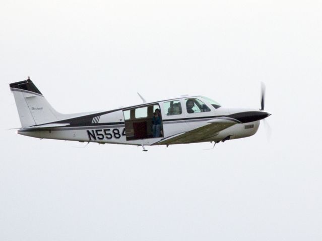 Beechcraft Bonanza (36) (N5584R) - Oshkosh 2013! Note the photographer in the cabin.