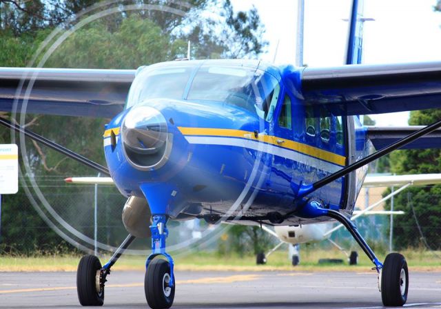 Cessna Caravan (LVN) - Skydive Australias Wollongong flagship preparing for a weekend load in front of the AMC hangar.