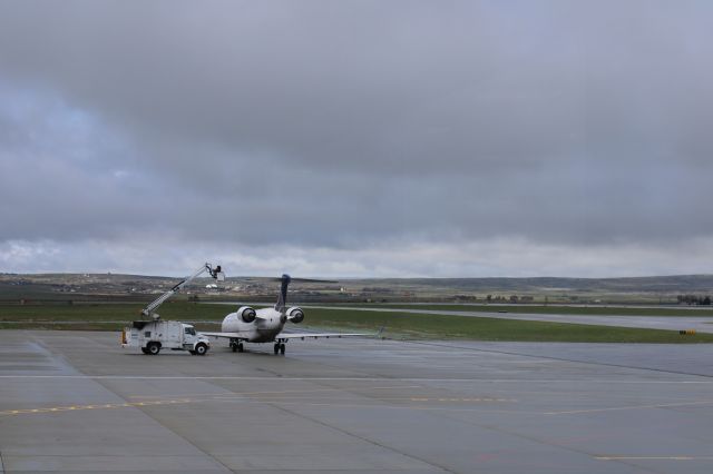 Canadair Regional Jet CRJ-700 (N156GJ) - From the observation deck at KCPR deicing