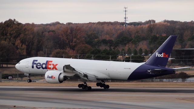 BOEING 777-200LR (N897FD) - "Stan" arrives on 18R.