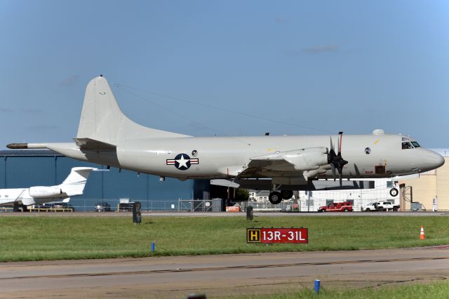 Lockheed P-3 Orion (UNKNOWN) - US Navy P-3C Orion arriving at Love Field. This P-3C is stationed at DAL to test equipment for Raytheon. They have no markings at all but are thought to belong to  NAWC-23 or Naval Air Systems Command-Flight Support Detachment.