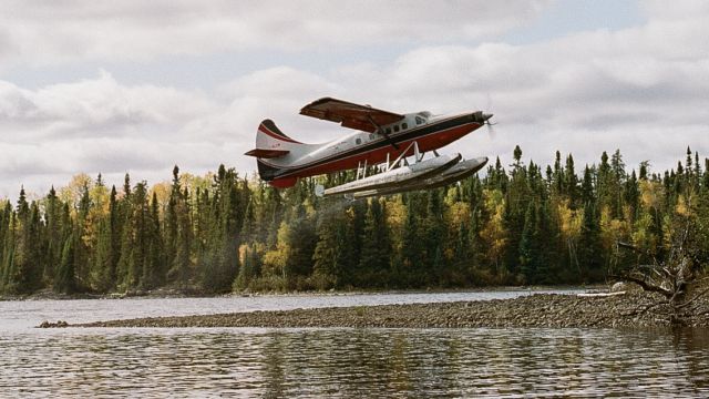 De Havilland Canada DHC-3 Otter (C-GLCW) - Leuenberger Air Service pilot Angus McKenzie flying turbine Otter LCW departs the river at Mojikit in northern Ontario from delivering moose hunters into the wilderness. br / Photo by Thomas Skrlj 