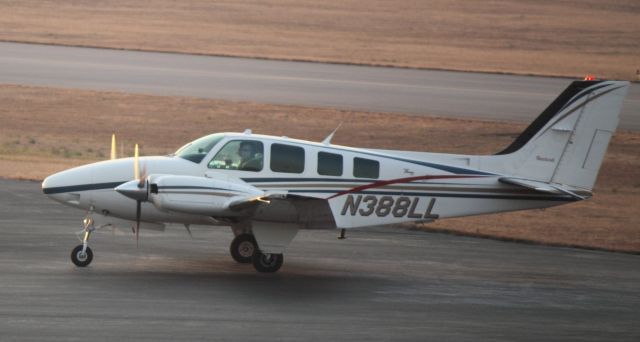 Beechcraft Baron (58) (N388LL) - Taxiing to Hill Aviation at FTY on 02/15/2011