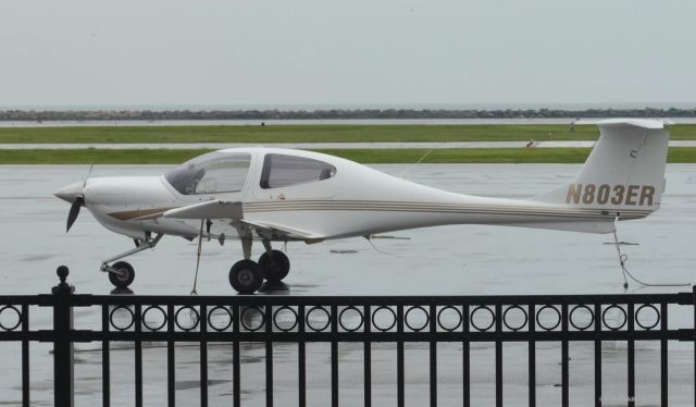 Diamond Star (N803ER) - N803ER seen from the terminal at KBKL on a rainy day at this airport in Downtown Cleveland. Please look for more photos at Opshots.net