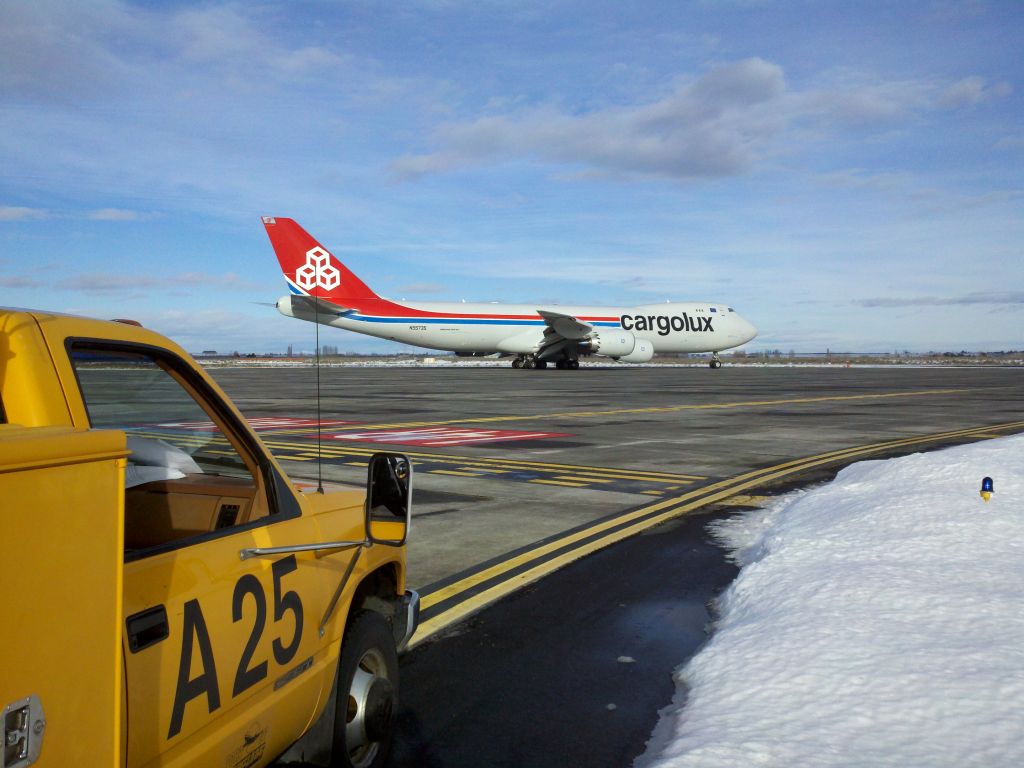 BOEING 747-8 (N5573S) - Boeings new cargo plane passed me as I was doing the afternoon F.O.D. inspection today.