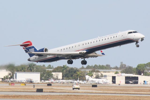 Canadair Regional Jet CRJ-900 (N956LR) - Mesa Airlines/US Airways Express Flight 2647 (N956LR) departs Runway 14 at Sarasota-Bradenton International Airport enroute to Charlotte/Douglas International Airport