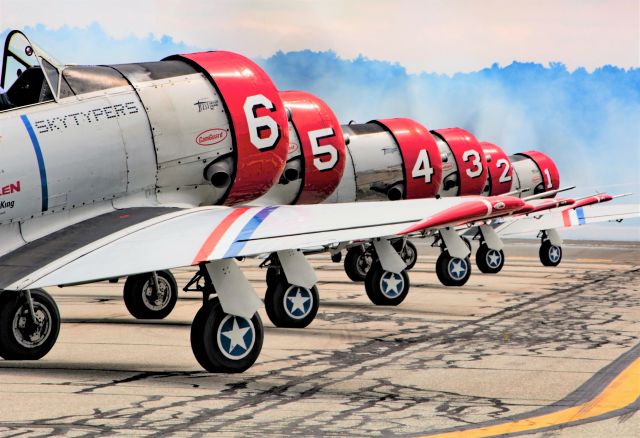 North American T-6 Texan (N62382) - Smoke Trail laid down by Greg Colyer in the Ace Maker 2 just prior to this snap. Thanks Greg! :)