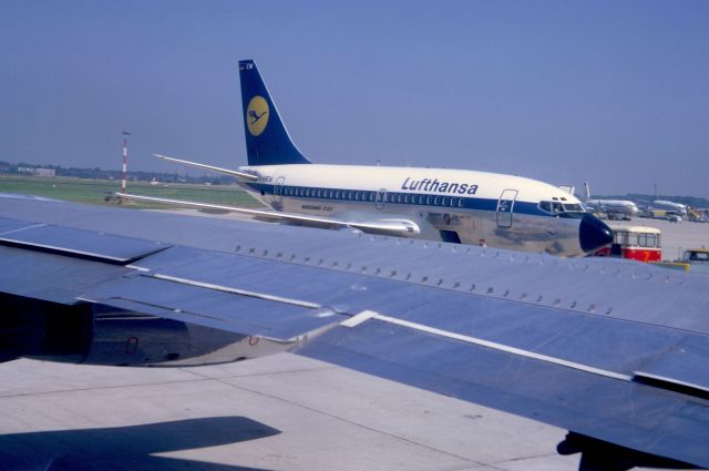 Boeing 737-100 (D-ABEW) - July 1969 at Düsseldorf (EDDL) - picture taken from inside Lufthansa B-707-430 D-ABOC departing for KJFK via EHAM.