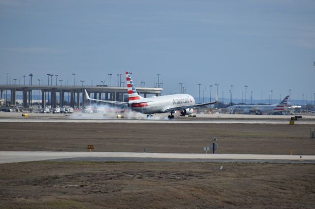 Boeing 737-800 (N909AN) - Taken at the Founders Plaza, while watching planes land onto runway 18R