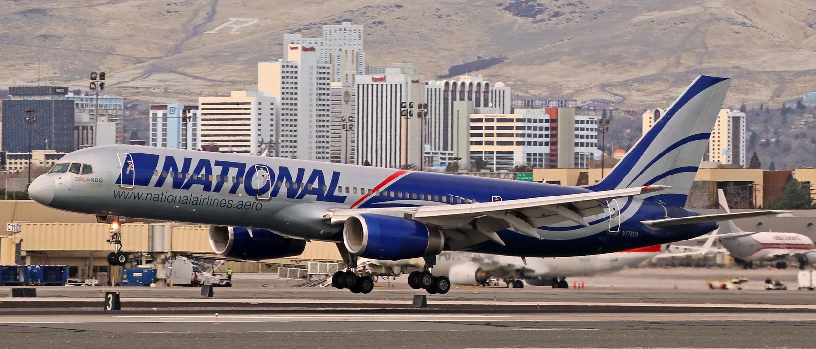 Boeing 757-200 (N176CA) - Arriving from Cherry Point (KNKT), National Cargos N176CA is caught here flaring out to touch down on KRNOs 16R.