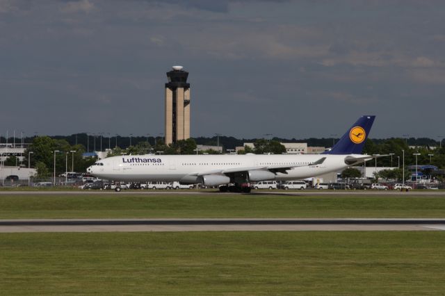 Airbus A340-300 (D-AIGX) - 5/15/06 Taxiing by KCLT control tower.