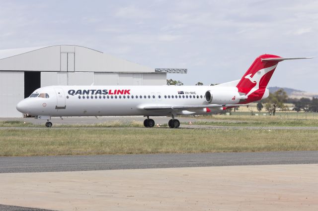 Fokker 100 (VH-NHC) - Network Aviation (VH-NHC), in newly painted QantasLink, taxiing at Wagga Wagga Airport.