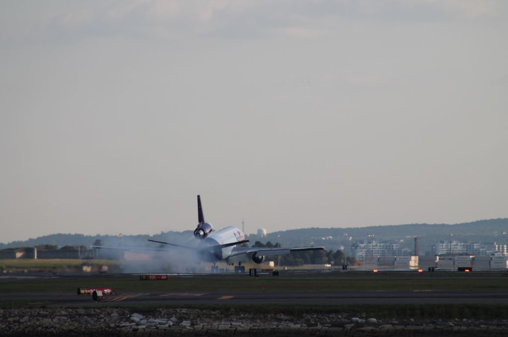 McDonnell Douglas DC-10 (N307FE) - Final shot of N307FE touching down on 22L at Logan. Nice gear smoke.