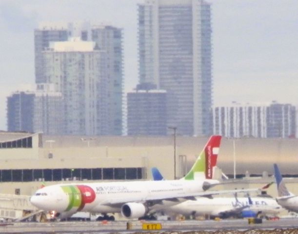 Airbus A330-200 (CS-TOP) - Departing for Lisbon(Lisboa){LIS/LPPT} "With the Miami Skyline"In the background!!