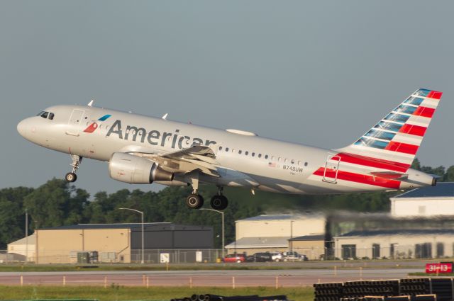 Airbus A319 (N748UW) - American 2189 departs DSM for Charolette Douglas in beautiful golden hour lighting. Photo taken July 5, 2022 at 06:51 AM with Nikon D3200 at 300mm.