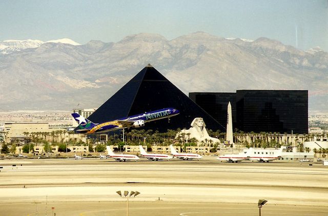 Boeing 757-200 — - KLAS - former America West Airlines 757 Battle Born departs KLAS over the UFO fleet at McCarran Intl Airport., adjacent to the Luxor Casino and Resort.