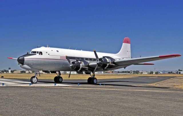 Douglas C-54 Skymaster (N460WA) - Douglas C-54 Skymaster with Sam and Ryan taking runway three-zero for departure at Merced Regional Airport (KMCE)