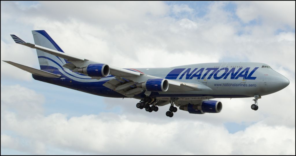 Boeing 747-400 (N949CA) - In memory of the seven Americans who lost their lives in the tragic crash of this National Airlines B747-400 named "Lori" which occurred one year ago tomorrow (April 29, 2013) at Bagram Airfield, Parwan Province, Afghanistan, this photo of "Lori" taken just 35 days earlier (Mar 26, 2013) as it was on short final to Reno Tahoe Intls runway 16R is submitted.  May Pilots Brad Hasler and Jeremy Lipka, First Officers / Navigators Rinku Summan and Jamie Brokaw, Loadmaster Michael Sheets, and Maintenance Crewmen Gary Stockdale and Timothy Garrett have Blue Skies Forever.