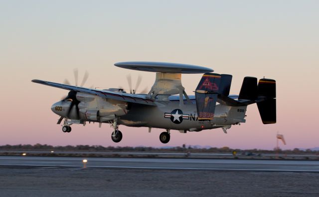 Grumman E-2 Hawkeye (16-8592) - An E-2D Hawkeye of VAW-125 (Carrier Airborne Early Warning Squadron) flares out to land on runway 31L at NAS Fallon just moments after the sun has gone down behind the Desert Range Mountains west of the base.  VAW-125 is homeported at NAS Norfolk and flies from the USS Theodore Roosevelt (CVN-71).