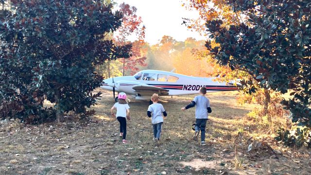 Piper Aztec (N20DM) - First Contact. This was the first time that the kids saw the Aztec in person in November 2016. After engine shutdown, they came galloping through the magnolias to check out this beauty!  Photo Credit: Shelley Romey