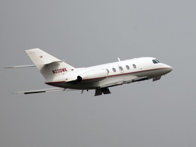 Dassault Falcon 20 (N200WK) - Take off runway 16. Westchester 3 SID. Gear retraction almost completed.