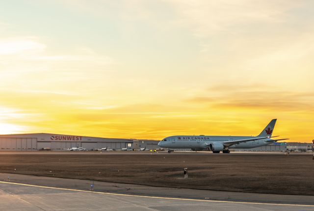 Boeing 787-8 (C-FGDT) - Sunrise at Calgary Airport with an Air Canada Dreamliner taxiing out