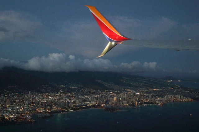 Boeing 737-700 — - Very first day of Southwest Airlines operating in Hawaii. Flying from Honolulu to Maui. Passing by Waikiki beach below. Told the pilot navigation was super easy in the islands. Just look for a runway on the second island east of Oahu and you're there. Questions about this photo can be sent to Info@FlewShots.com