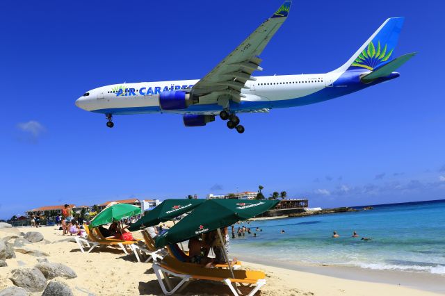 Airbus A330-200 (F-OFDF) - Air Caraibes over maho beach for landing at TNCM St Maarten.