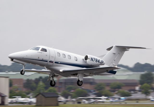 Embraer Phenom 100 (N784JP) - Take off runway 26